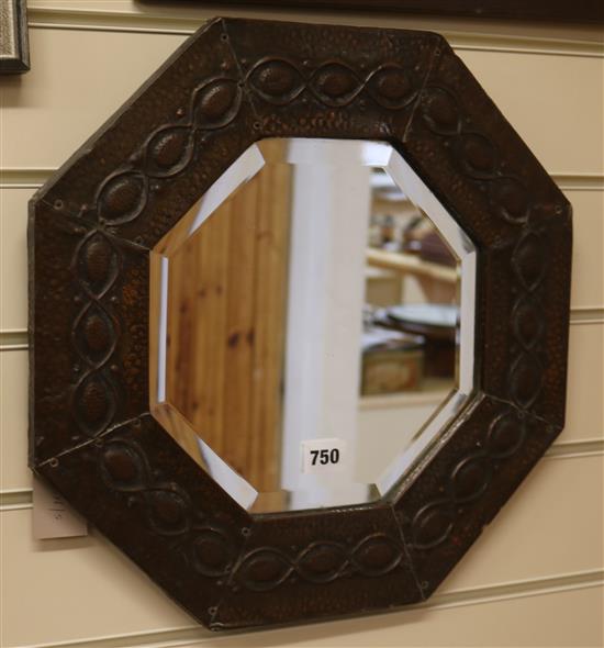 An Arts and Crafts copper mirror W.39.5cm
